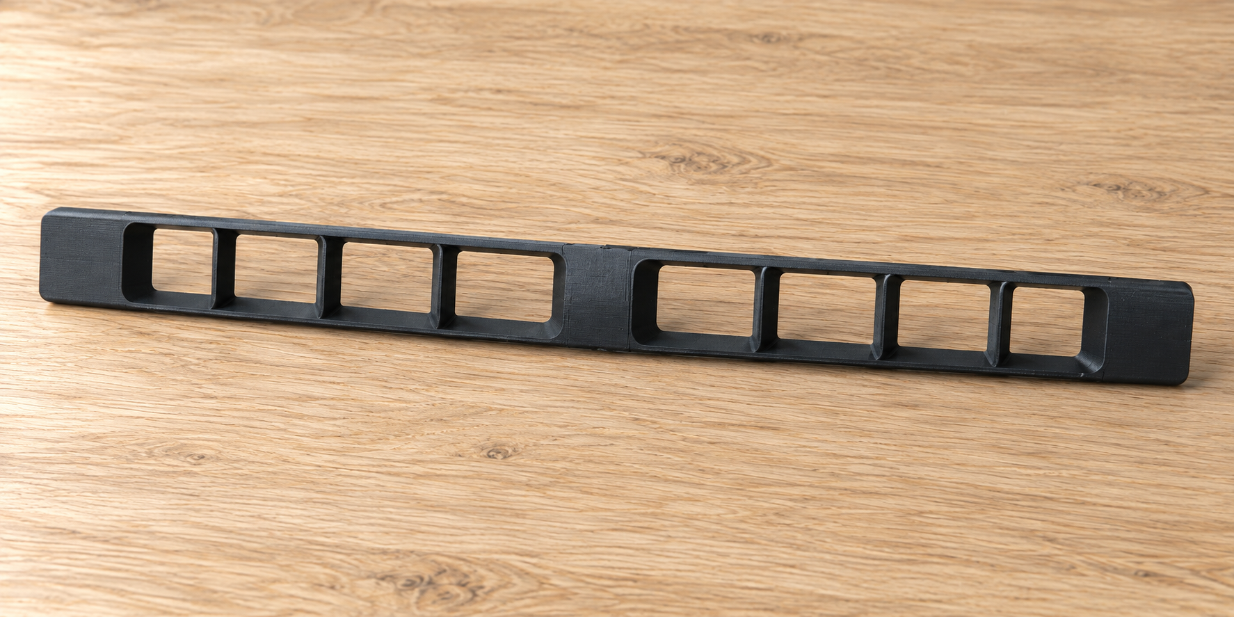 AI illustration: Lower bumper grille on a wooden table